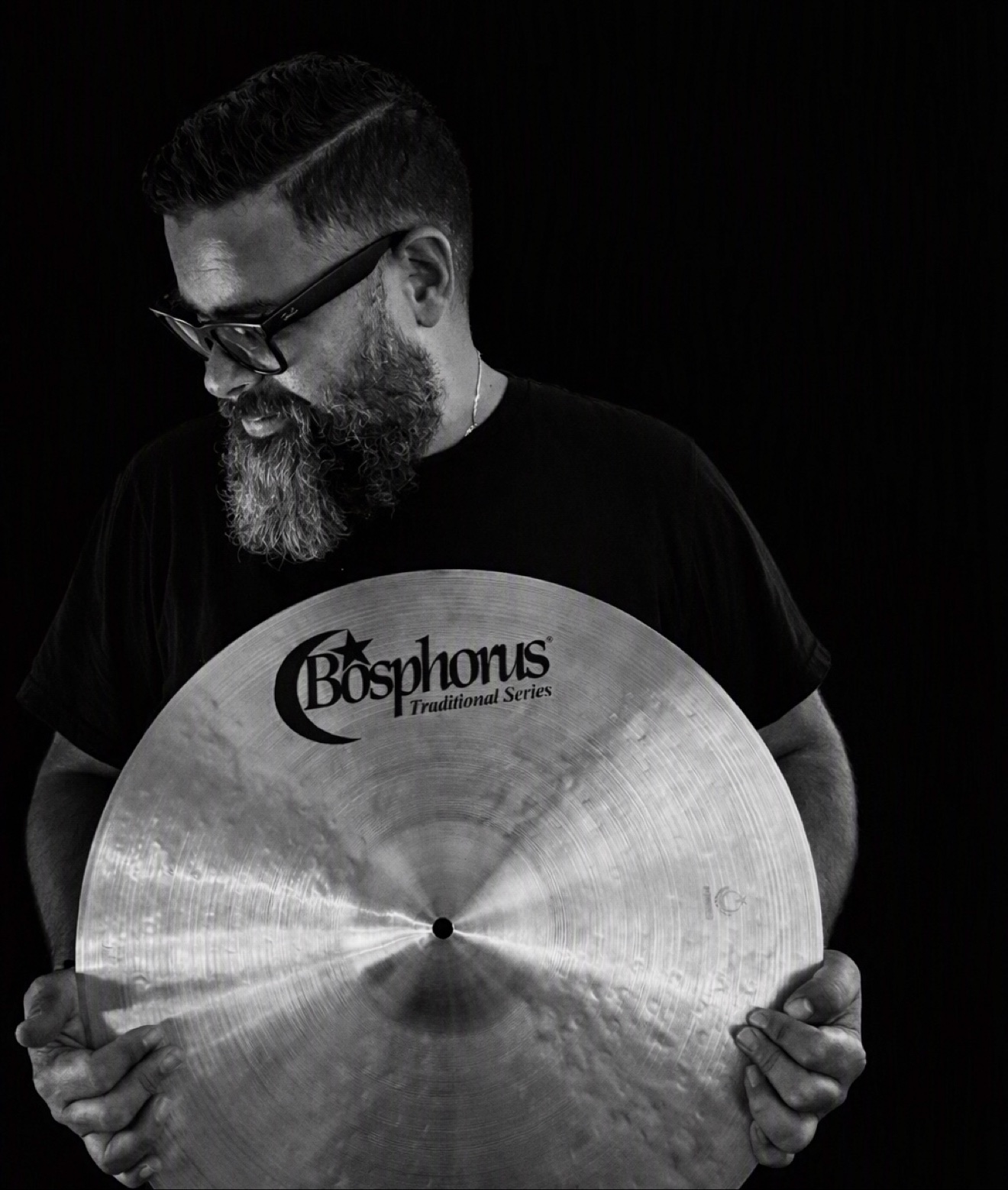 Emanuel Lozada holding a Bosphorus Traditional Series cymbal
